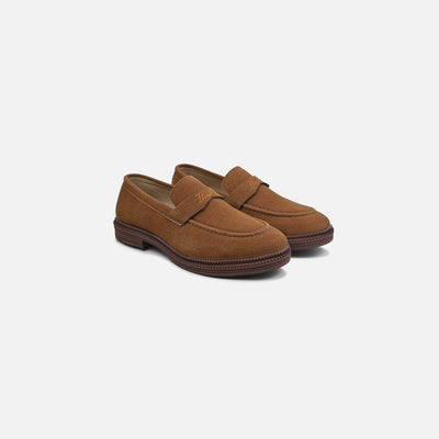Pair of brown loafers on a white background