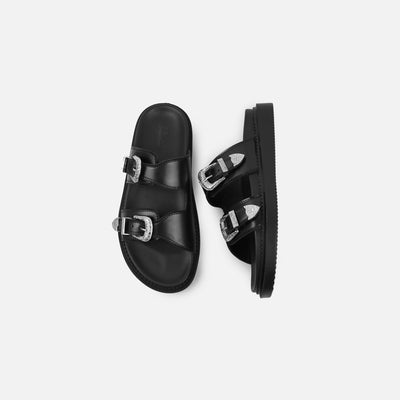 Black sandals with buckles on a white background