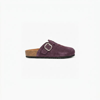 Purple suede clog shoe with a buckle on a white background