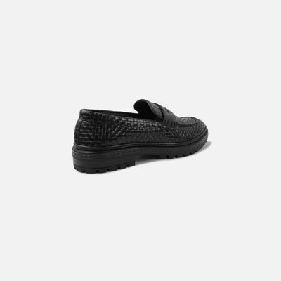 Black textured loafer shoe on a white background