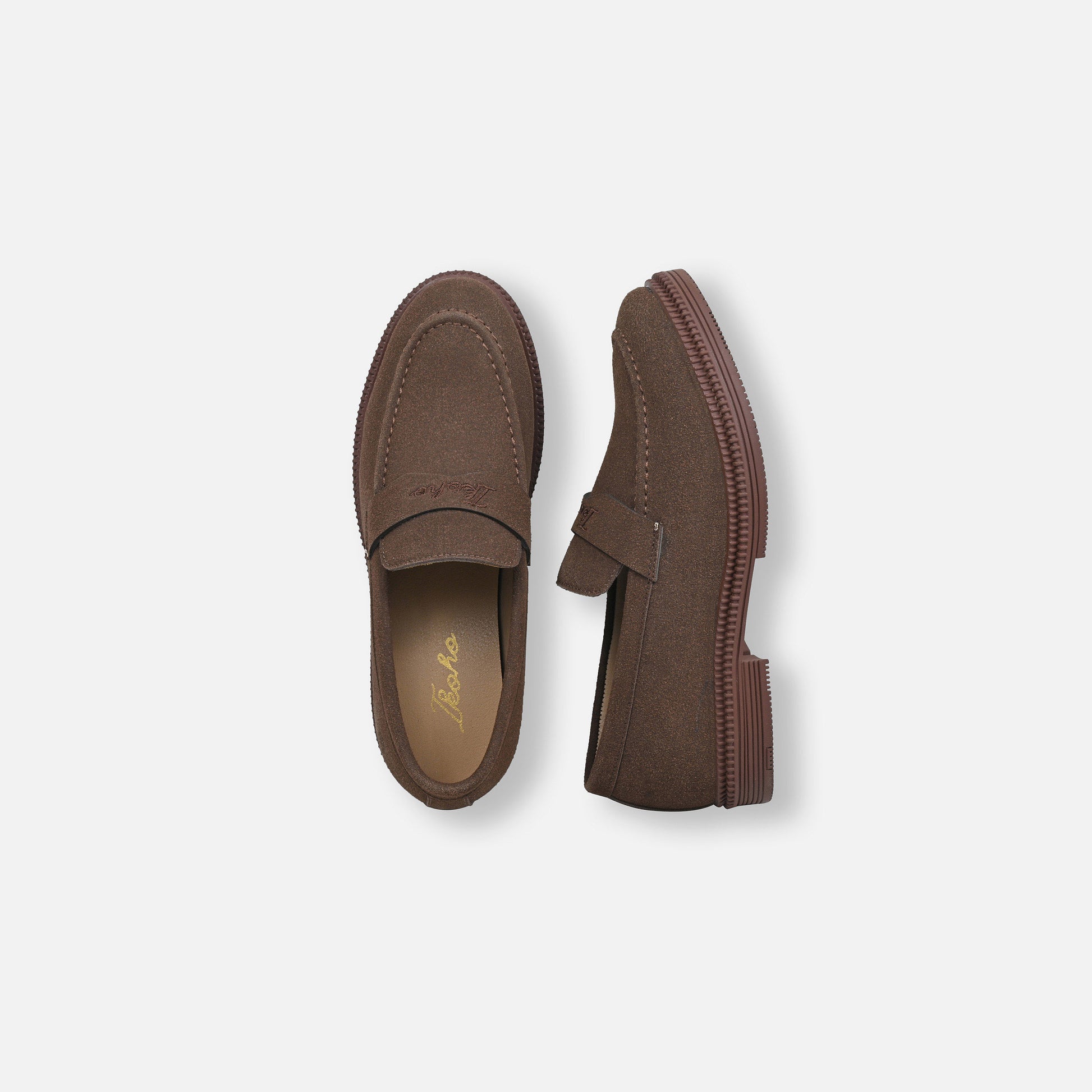 A pair of brown suede penny loafers shown from top and side views on a light gray background.