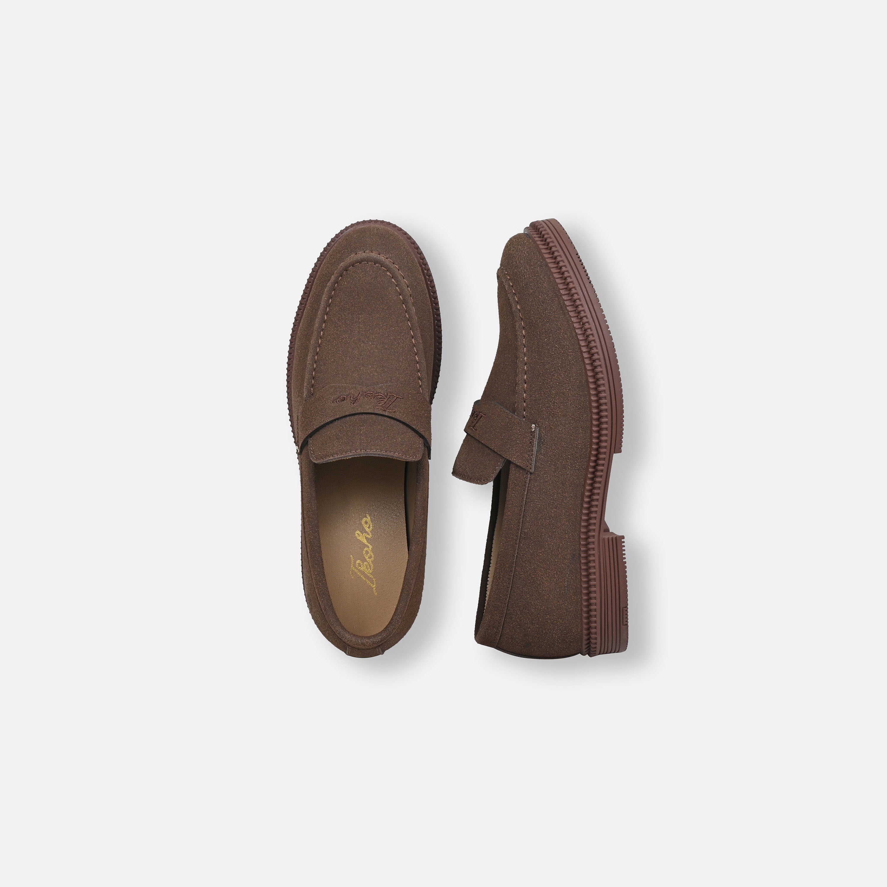 A pair of brown suede penny loafers shown from top and side views on a light gray background.