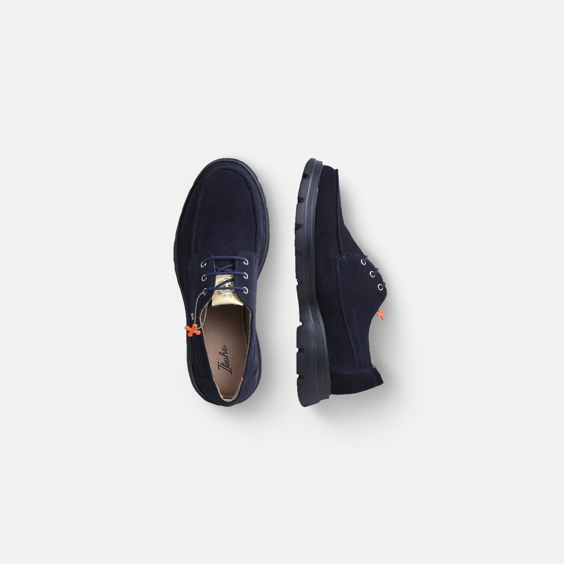 A pair of navy blue suede lace-up shoes shown from top and side views on a light gray background.