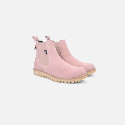 Pair of pink Chelsea boots on a white background