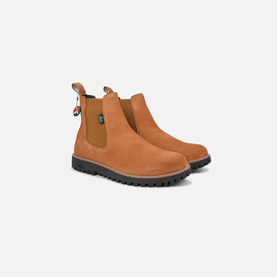 Pair of brown suede boots on a light gray background