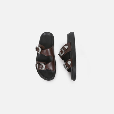 Pair of black and brown sandals with buckles on a white background