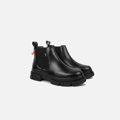 Pair of black Chelsea boots on a white background