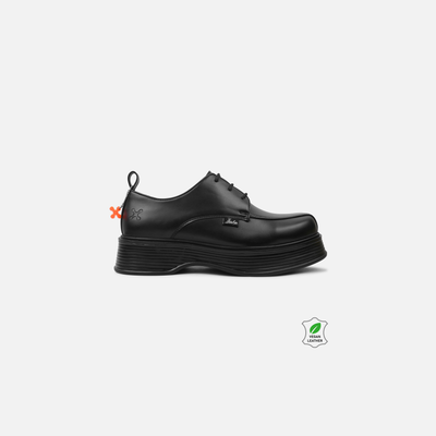Black leather shoe on a white background with brand logos.